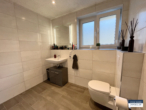 Barrierefreie, neuwertige Souterrain-Wohnung in gehobener Ausführung - Badezimmer