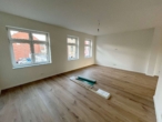 Erstbezug! Sanierte Maisonettewohnung in modernem Altbau - Wohnzimmer